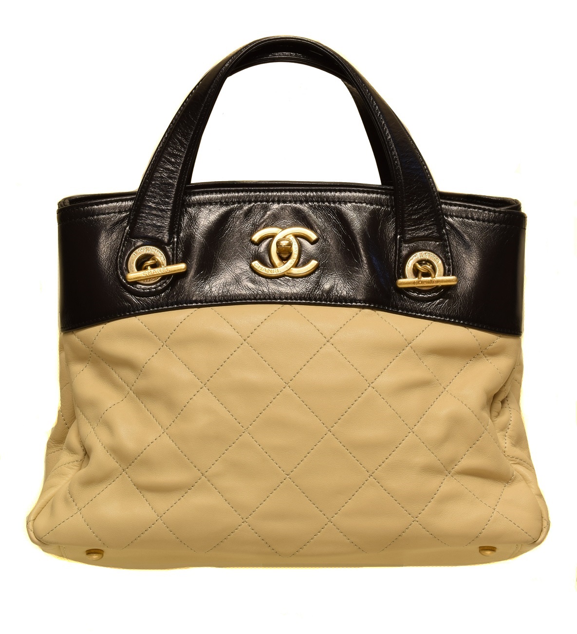 A Chanel In The Mix Shoulder Bag, circa 2012-3, the beige quilted calf leather exterior with smooth black leather detailing, gold tone hardware, interlace chain and black leather strap, serial no. 17422353. With maker's authenticity card and dust bag.  27x20x15cm  Sold for £1,586